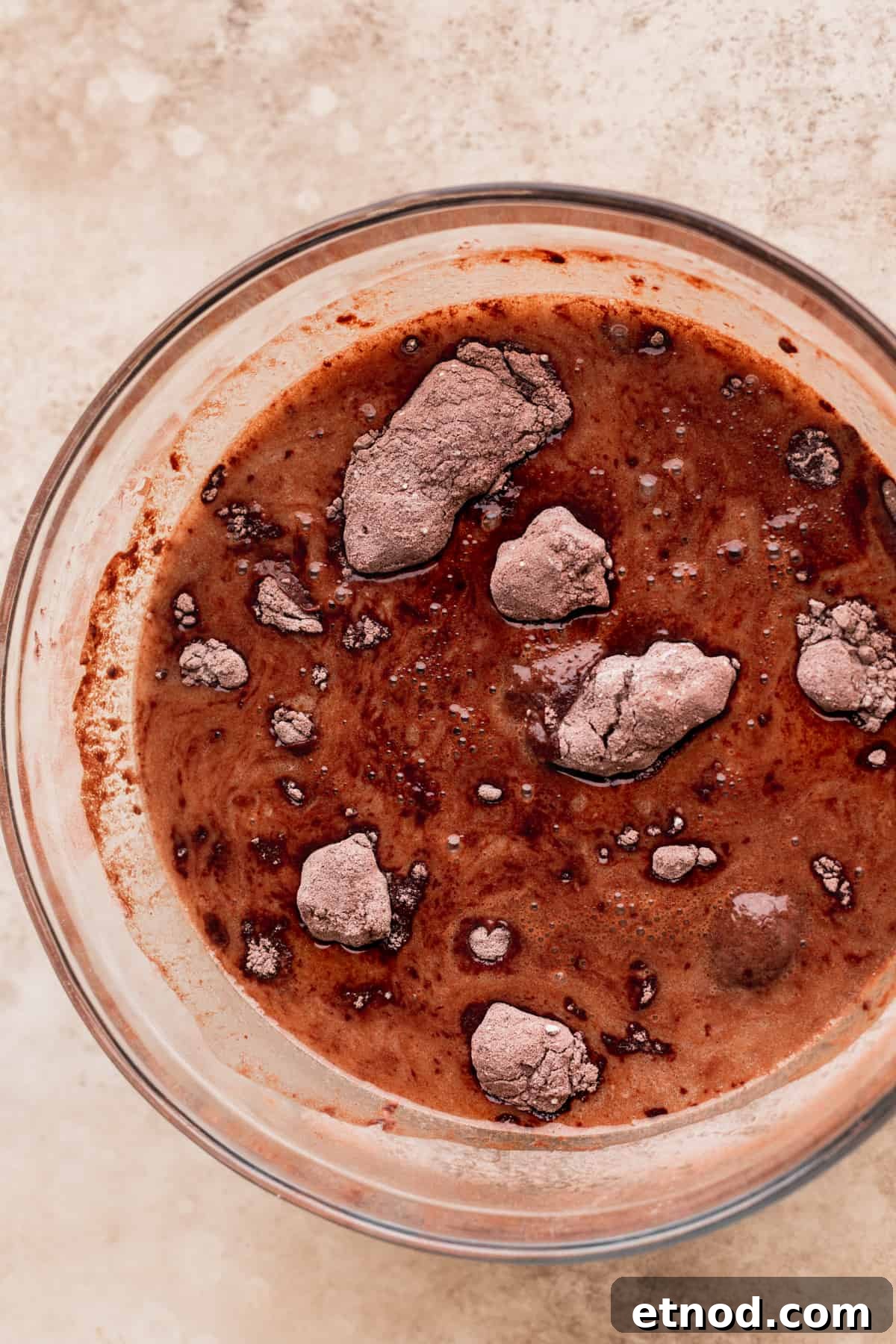 Andes Mint Chocolate Cake Recipe: Rich, Decadent Layer Cake 4 Wet ingredients added to the dry ingredients in a glass bowl.