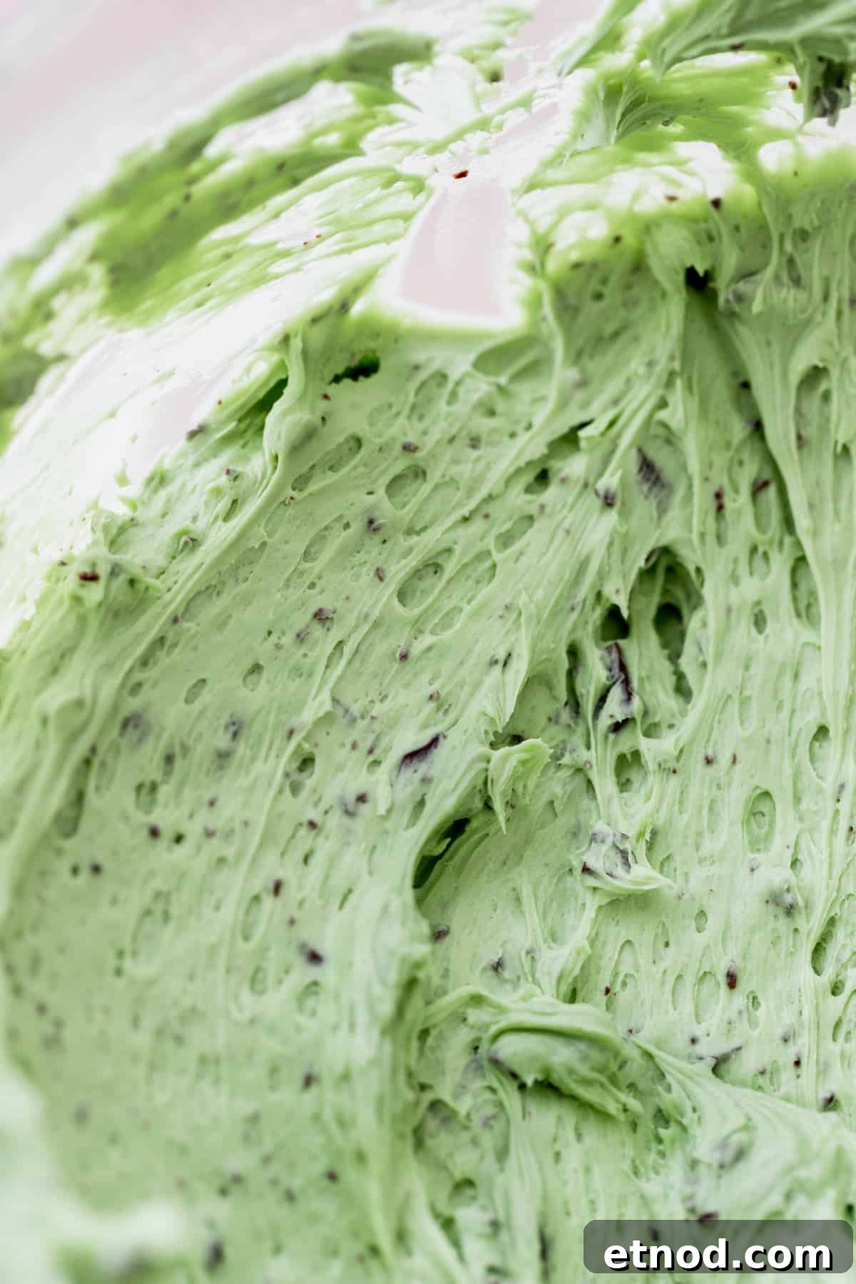 Andes Mint Chocolate Cake Recipe: Rich, Decadent Layer Cake 8 Chocolate chip mint frosting close up in a glass bowl.