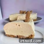 Slice of no bake caramilk cheesecake on a purple background.