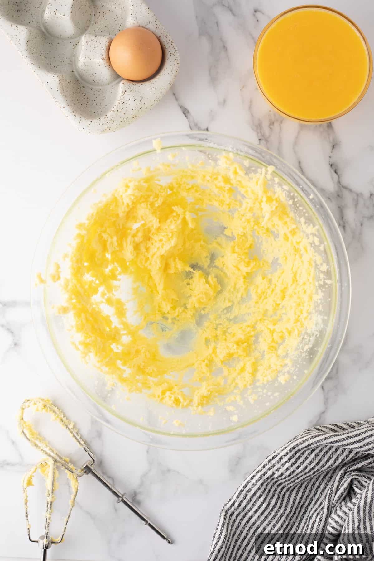 Lemon Curd Thumbprint Cookies — Zesty Jam-Filled Shortbread 4 Glass mixing bowl showing creamed butter and superfine sugar.