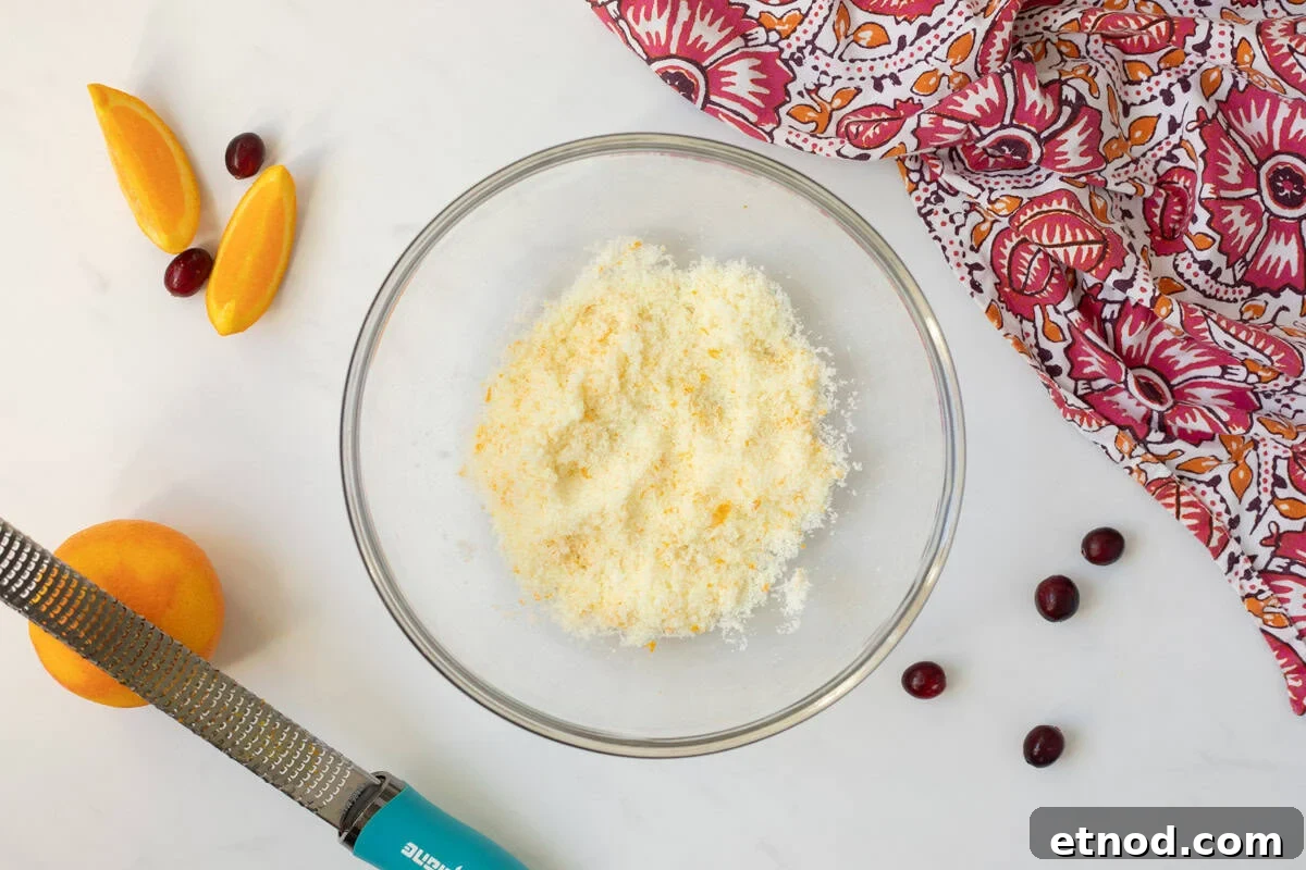 Cranberry Bread with Orange Zest Orange zest and sugar combined together in large mixing bowl.